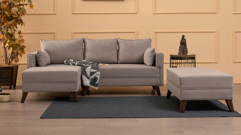 Divano letto moderno con penisola e pouf in tessuto cm 205x140x80h - vari colori