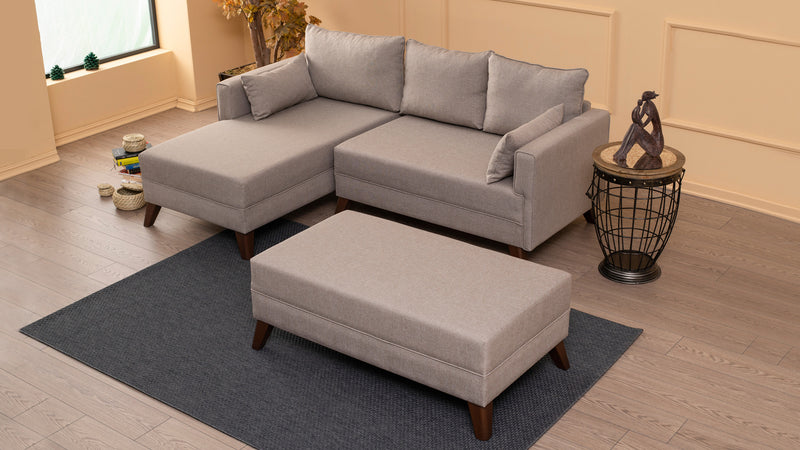 Divano letto moderno con penisola e pouf in tessuto cm 205x140x80h - vari colori
