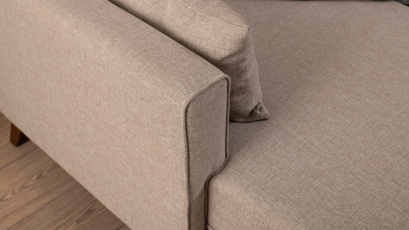 Divano letto moderno con penisola e pouf in tessuto cm 205x140x80h - vari colori