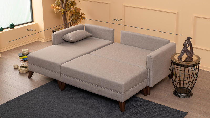 Divano letto moderno con penisola e pouf in tessuto cm 205x140x80h - vari colori