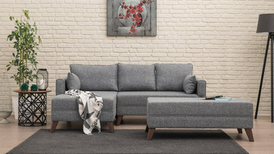 Divano letto moderno con penisola e pouf in tessuto cm 205x140x80h - vari colori