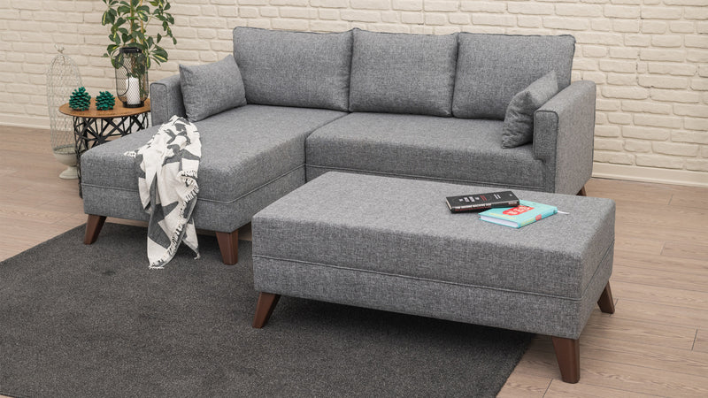 Divano letto moderno con penisola e pouf in tessuto cm 205x140x80h - vari colori