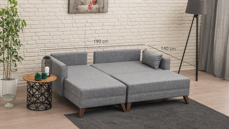 Divano letto moderno con penisola e pouf in tessuto cm 205x140x80h - vari colori