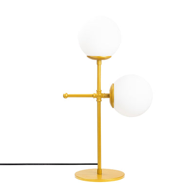 lampada moderna elegante da tavolo struttura ad incrocio in metallo dorato con 2 paralumi a sfera in vetro bianco