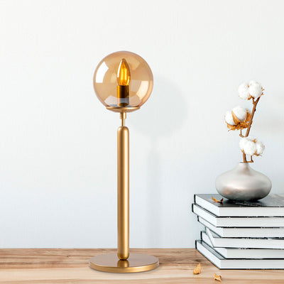 lampada moderna da tavolo asta verticale in metallo dorato paralume a sfera in vetro trasparente sfumatura colore oro