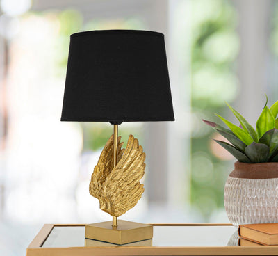 Lampada moderna da tavolo dorata con ali e paralume nero cm 25x45h