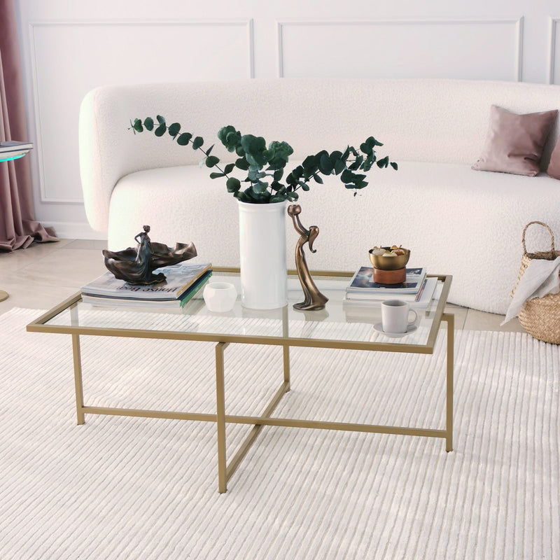 tavolino basso da salotto moderno in metallo colore oro piano in vetro trasparente