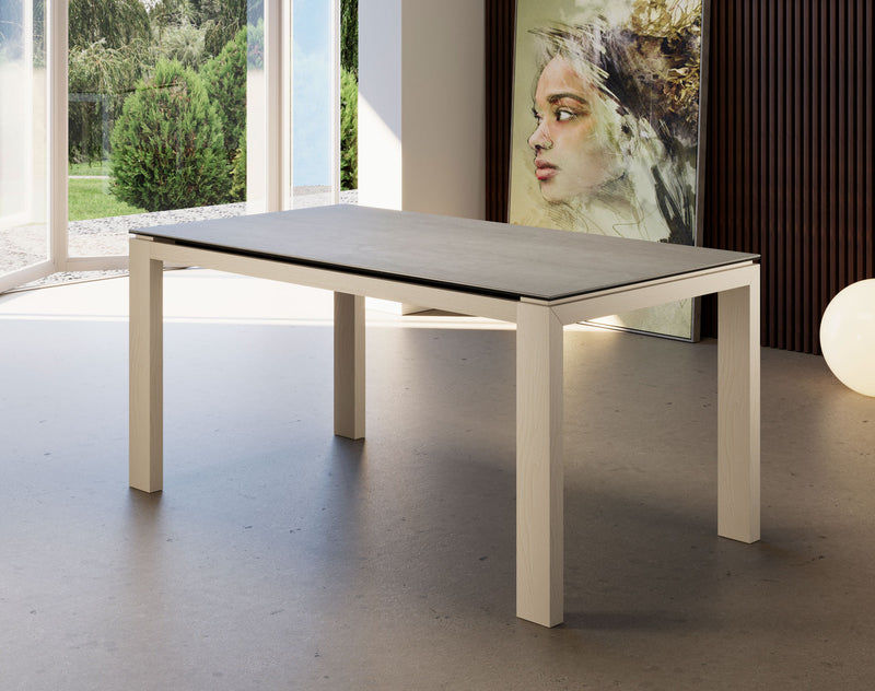 tavolo da pranzo allungabile moderno piano in ceramica pietra savoia perla gambe in legno frassino