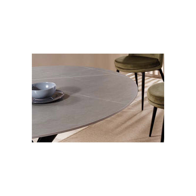 Tavolo moderno tondo in ceramica marmo grigio gambe incrociate in metallo cm 120x73h