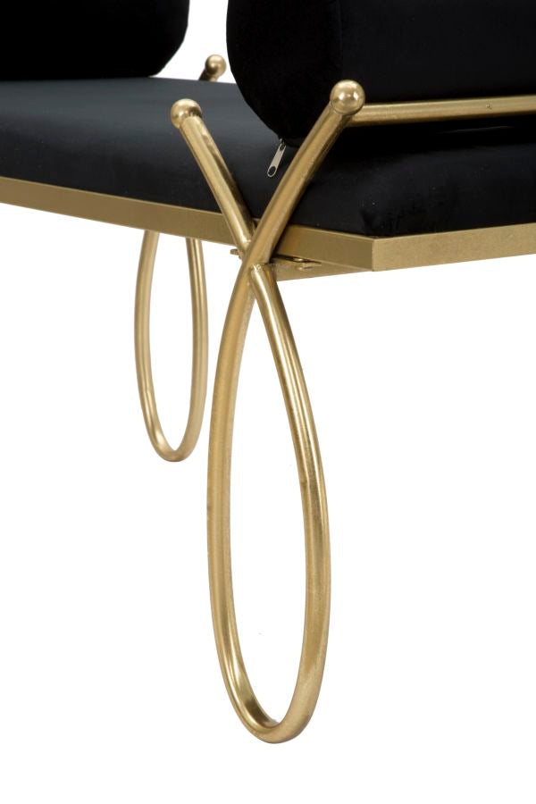 panca design in metallo colore oro seduta in velluto nero