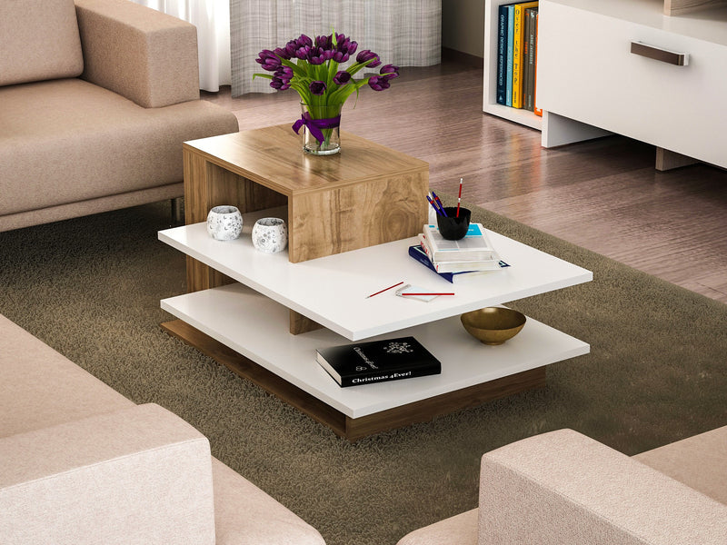 Tavolino basso da salotto in legno bicolore bianco opaco e finitura noce opaco, diviso in 4 ripiani e vani a giorno di diversa dimensione. Dimensioni cm 85x60x44h