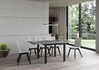 tavolo moderno allungabile quadrato piano cemento gambe in metallo